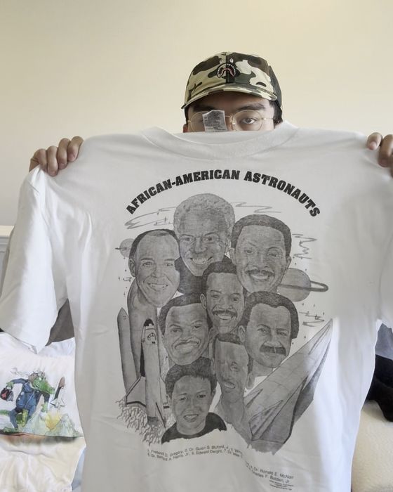 Graphic t-shirt held up to the camera